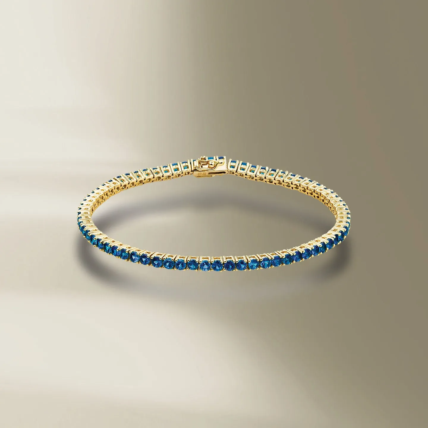 Tennis 18K Gold Bracelet w. Blue Sapphires